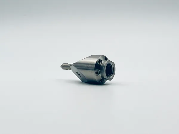 Side view of Mini Penetrating Nozzle metal housing compatible standard fittings used across heavy duty environments