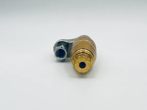 Side angle perspective of the reverse rotary nozzle mounted on automation equipment displaying coverage radius ideal for robotic painting integration systems